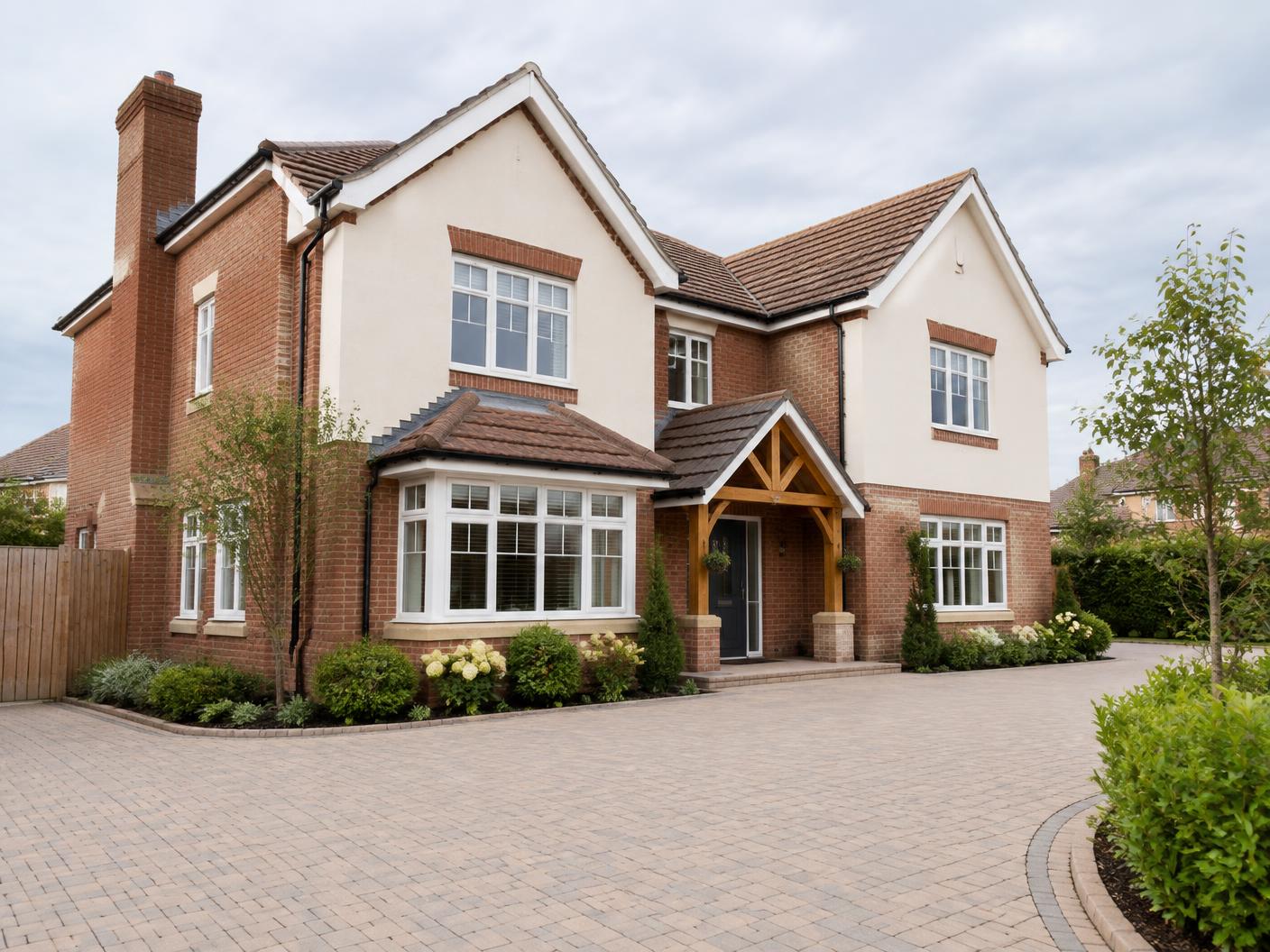 Welcoming detached residential home with a large paved driveway