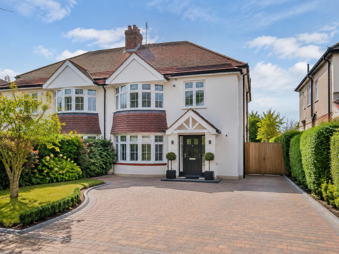 Welcoming semi-detached residential home with a large driveway